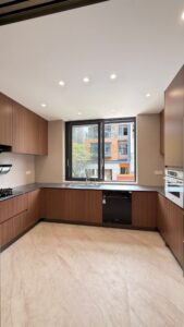 Stainless Steel Cabinets & Solid-Surface Countertops